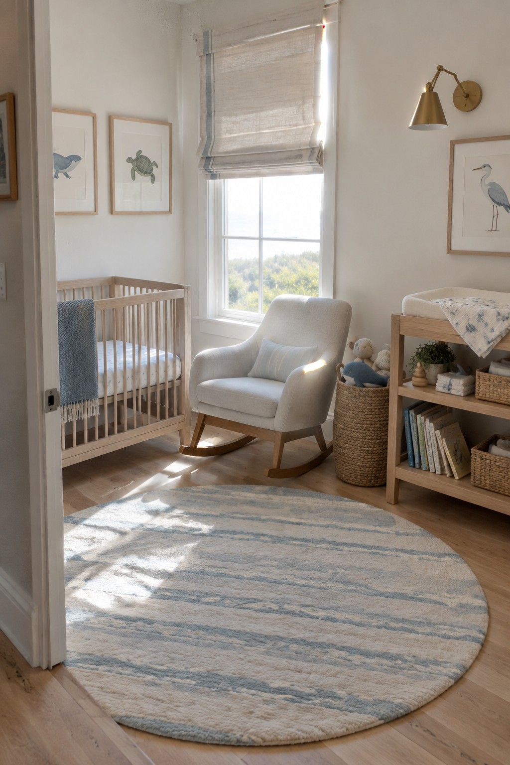 A nursery with a round pale blue rug, wooden crib, upholstered rocking chair, and wood shelving.